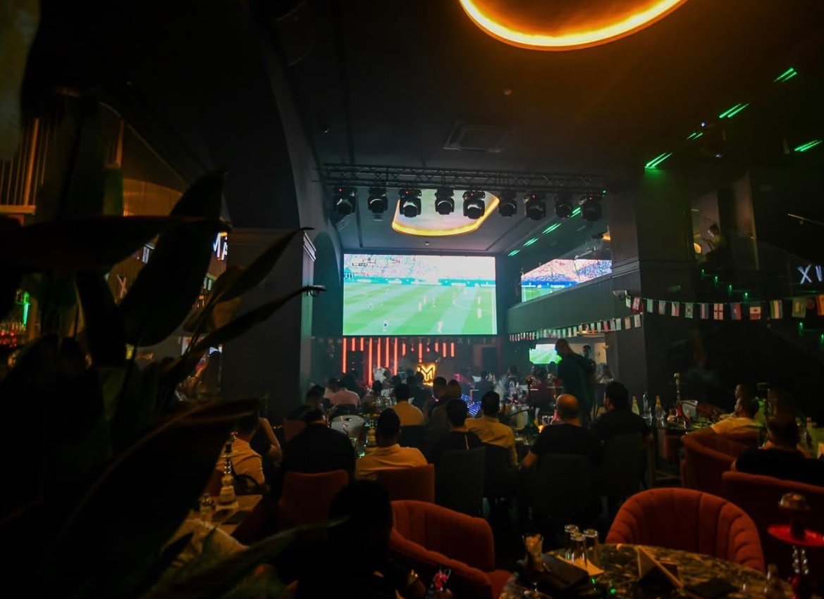 Watch football in Marrakech: giant LED screen behind the stage at Matrix Lounge