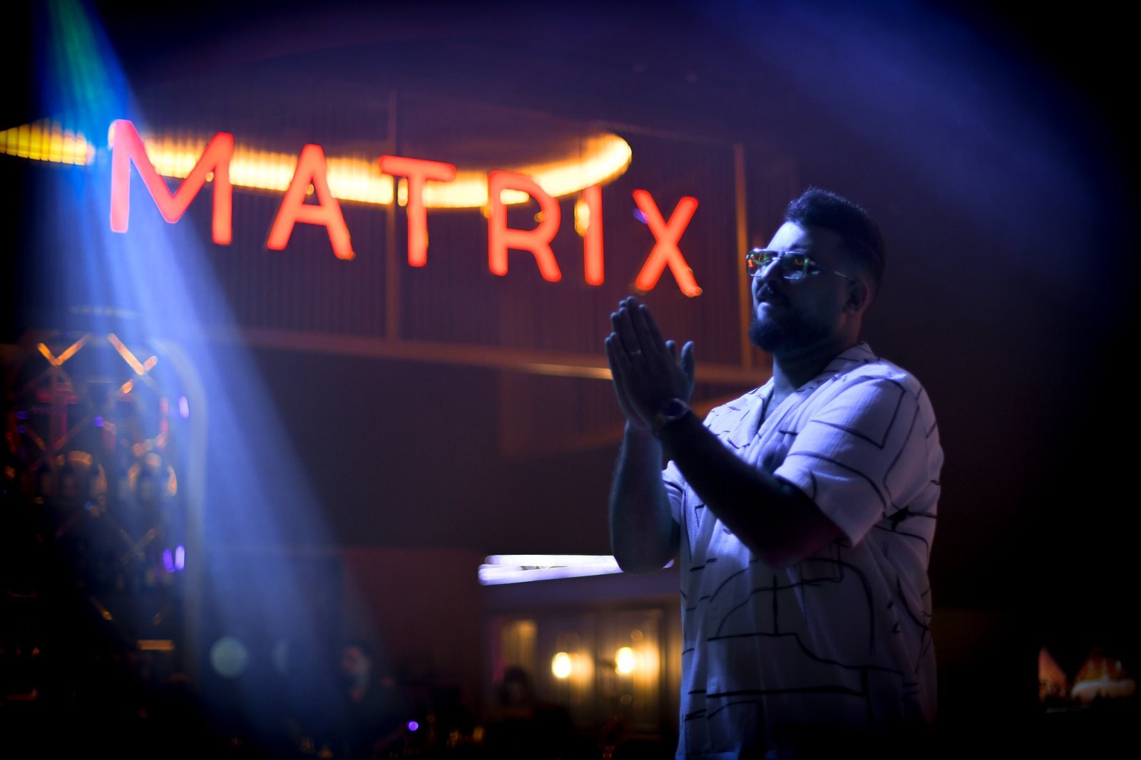 Marrakech nightlife at Matrix Lounge: live performer under stage lights and the Matrix sign